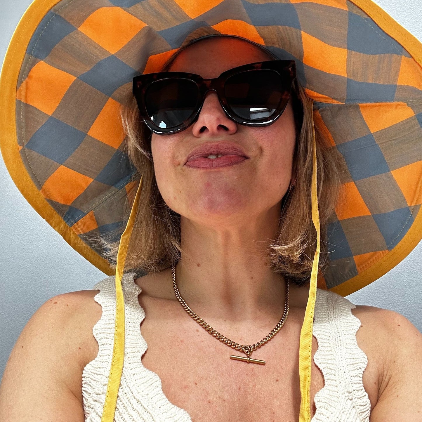Wide brimmed reversible checked sunhats