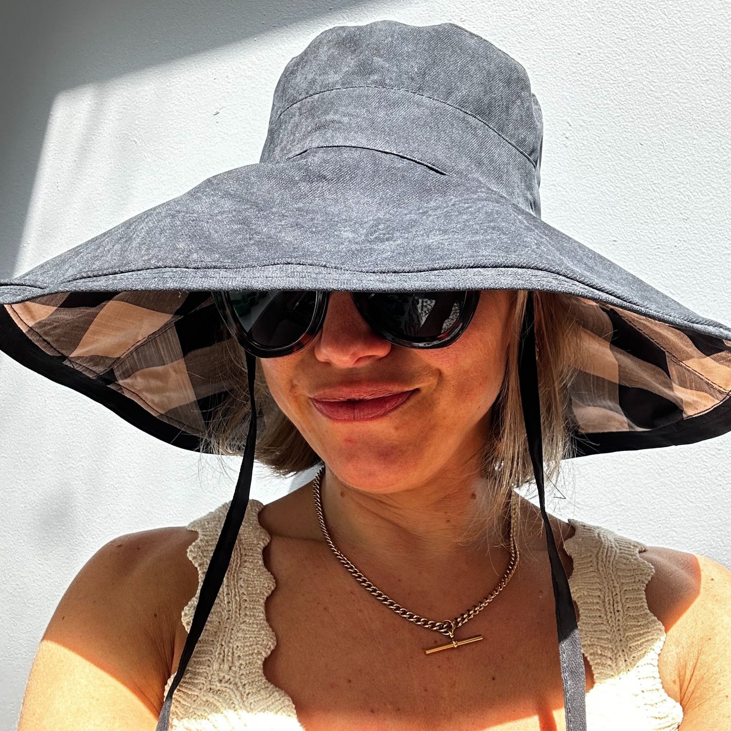 Wide brimmed reversible checked sunhats