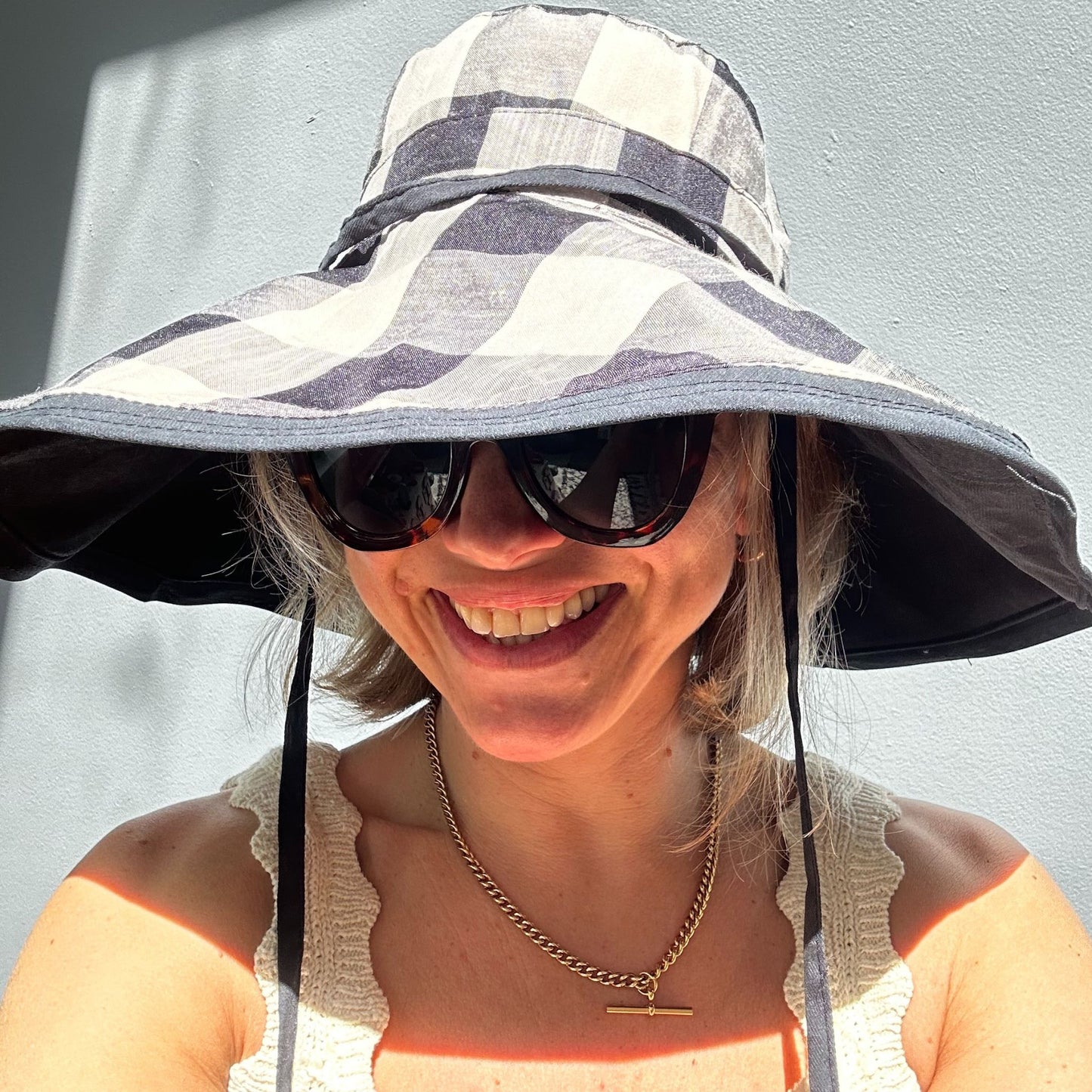 Wide brimmed reversible checked sunhats
