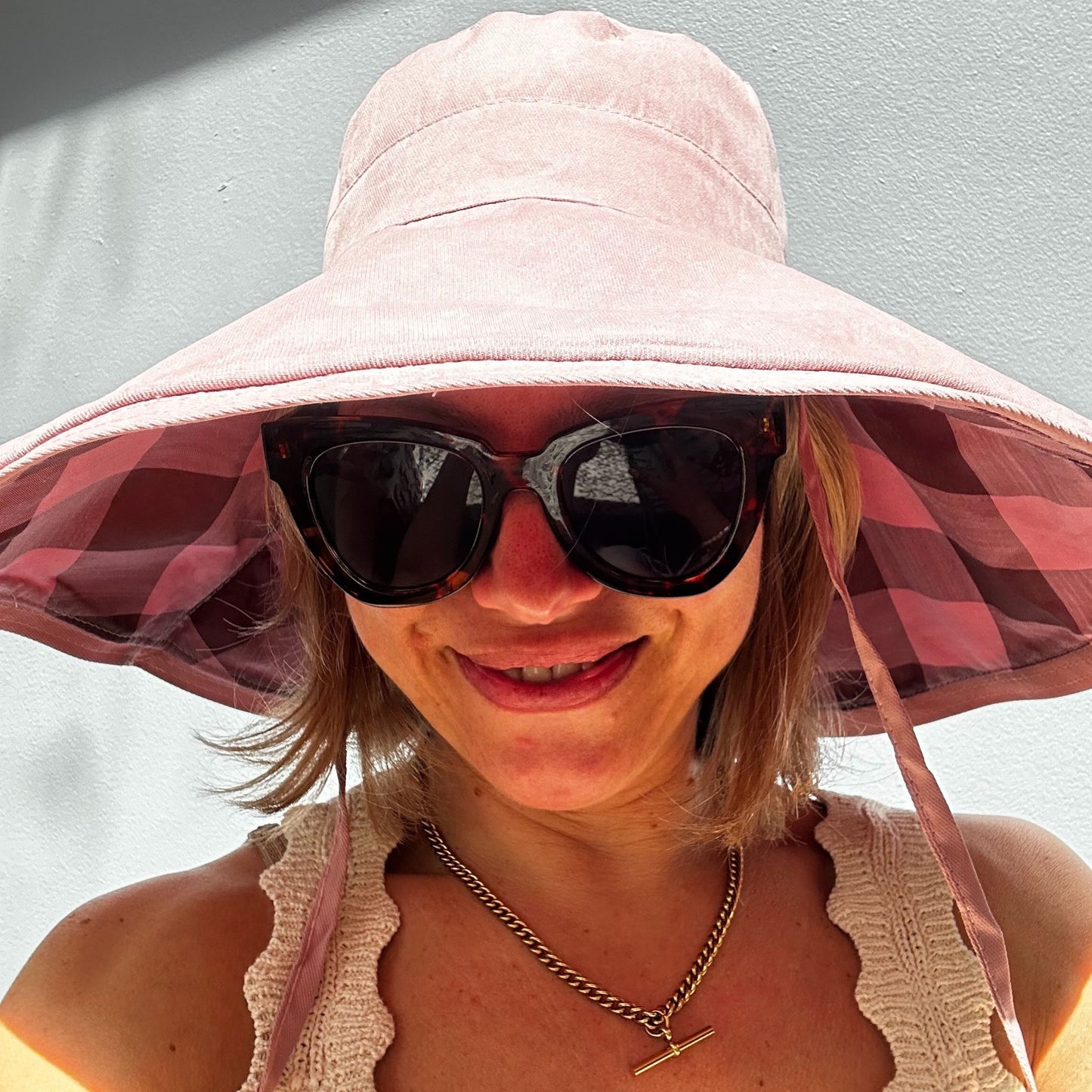 Wide brimmed reversible checked sunhats