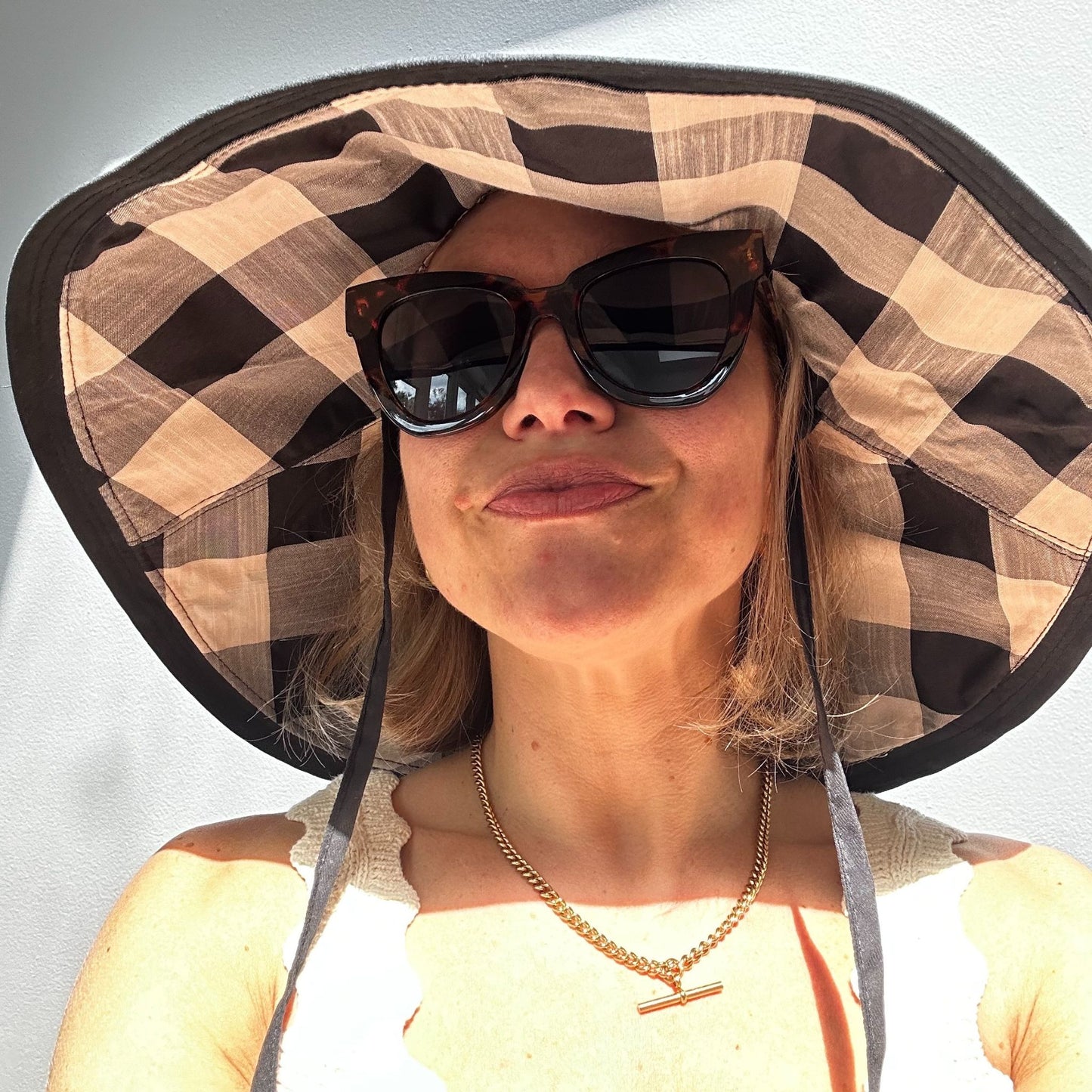 Wide brimmed reversible checked sunhats