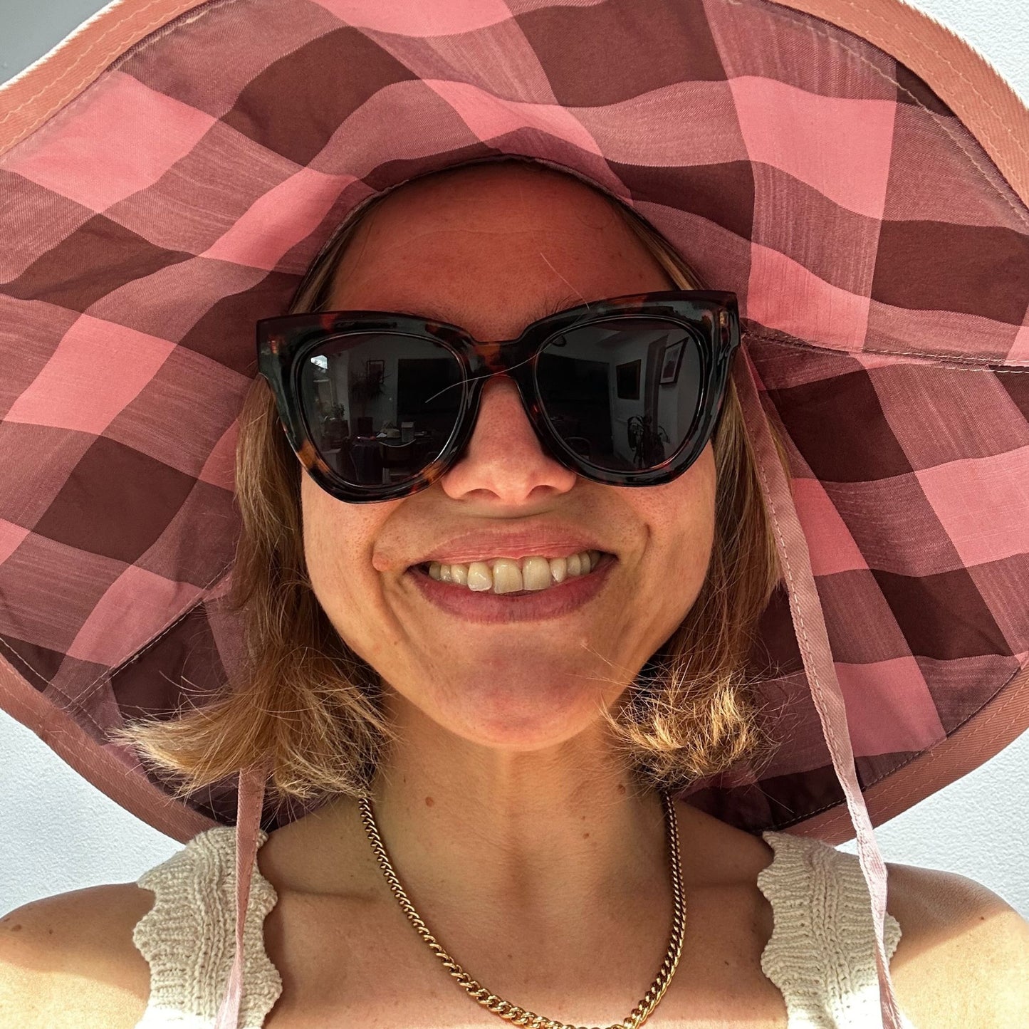 Wide brimmed reversible checked sunhats