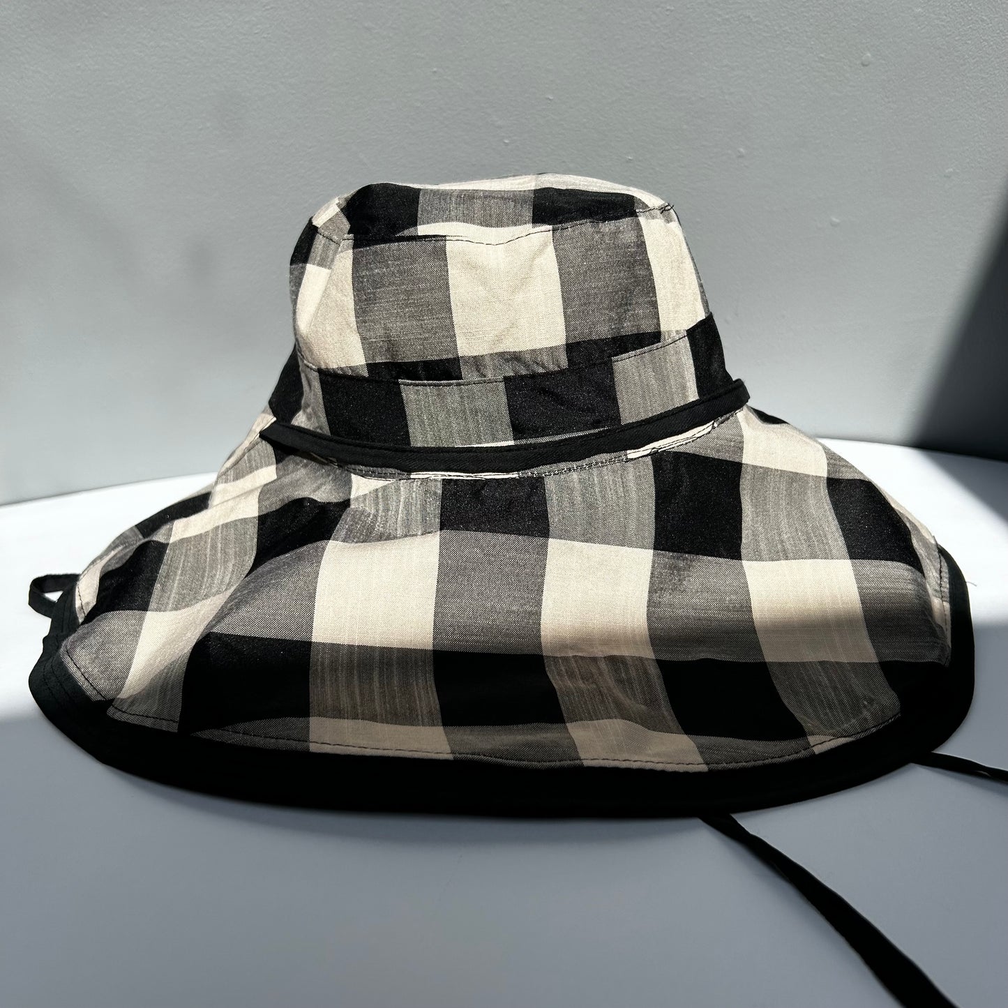 Wide brimmed reversible checked sunhats
