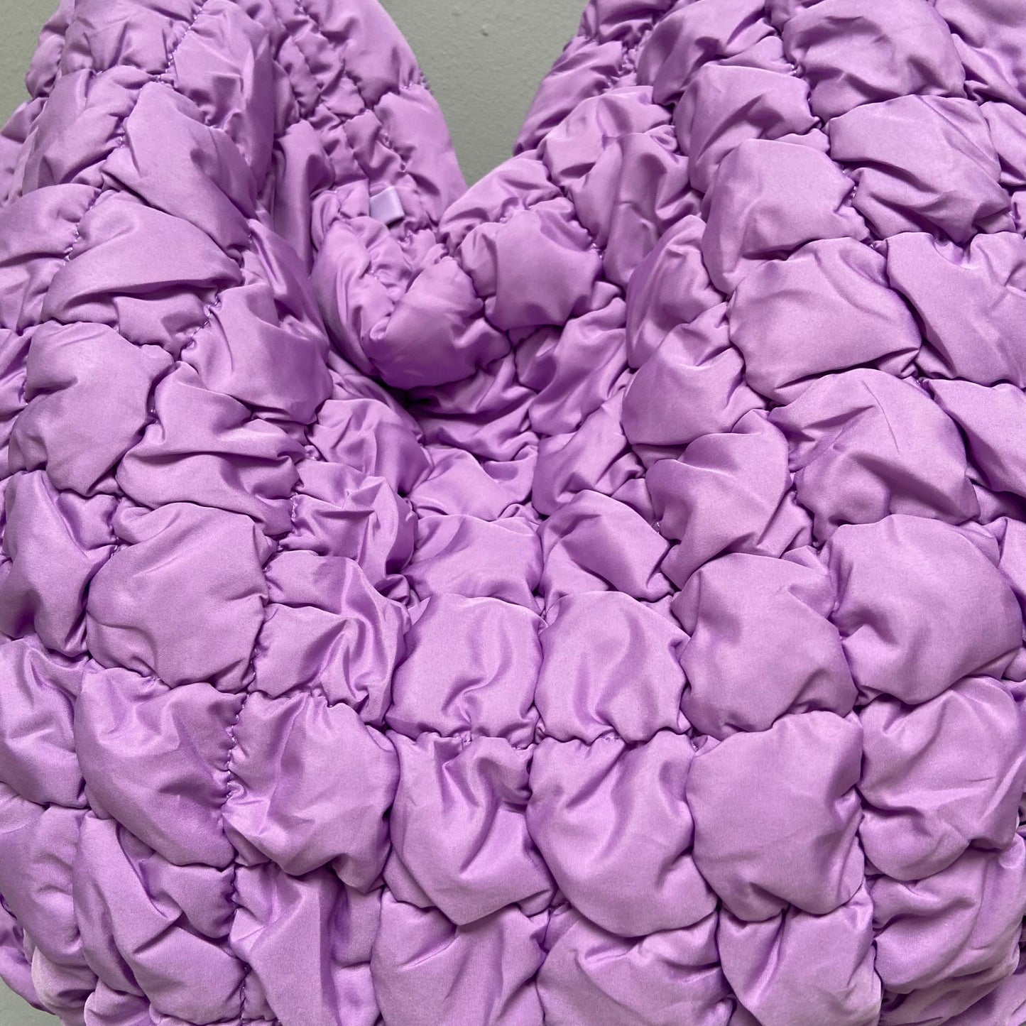 Squishy quilted bag with ample space for essentials, perfect on-the-go