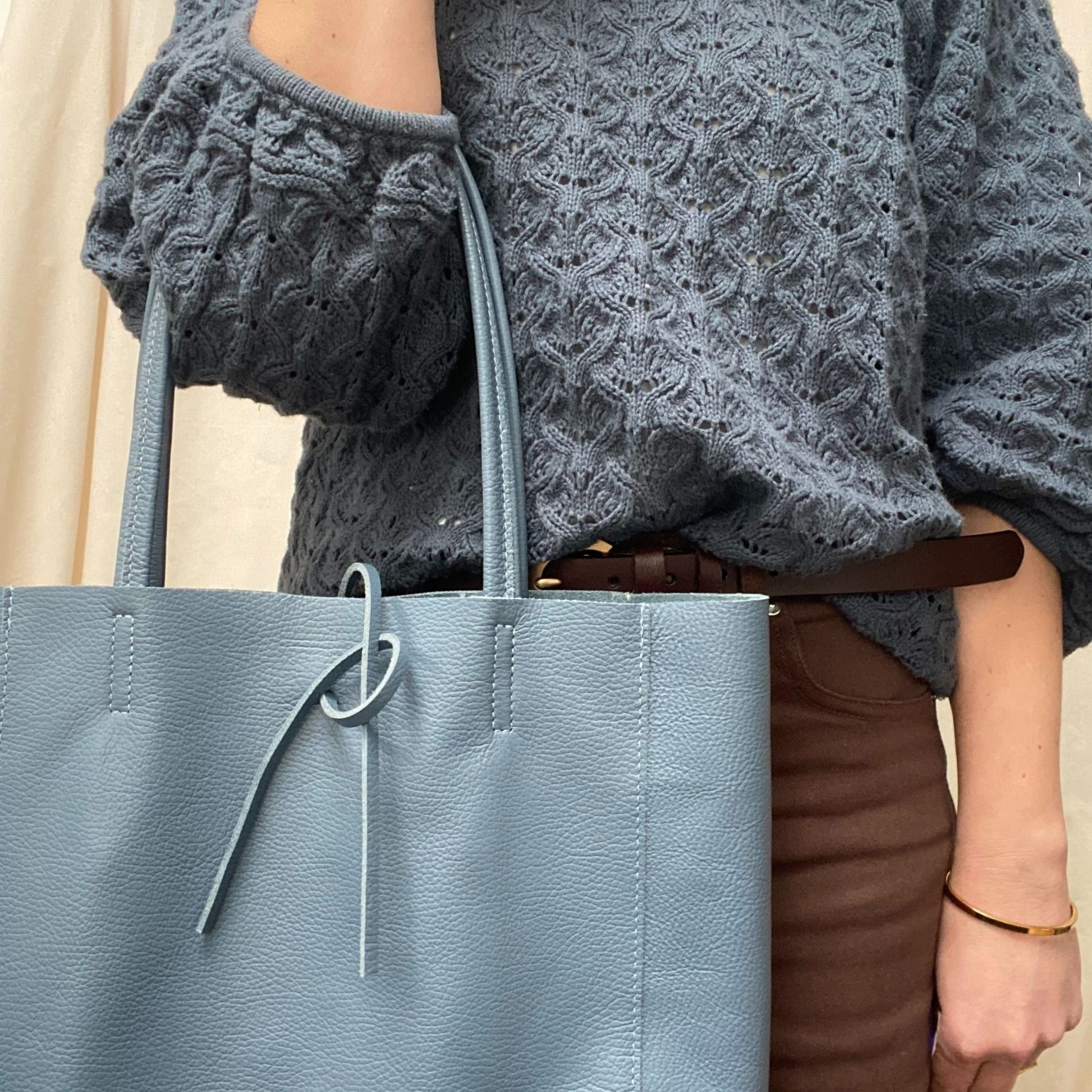 Lady with Blue leather shopper bag
