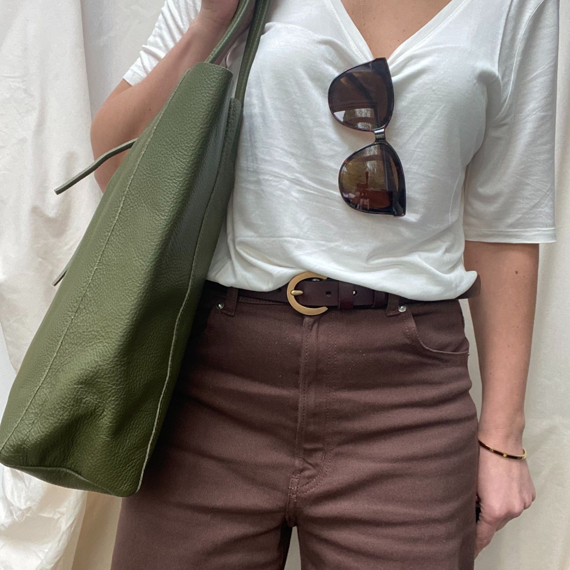 Lady holding green leather bag