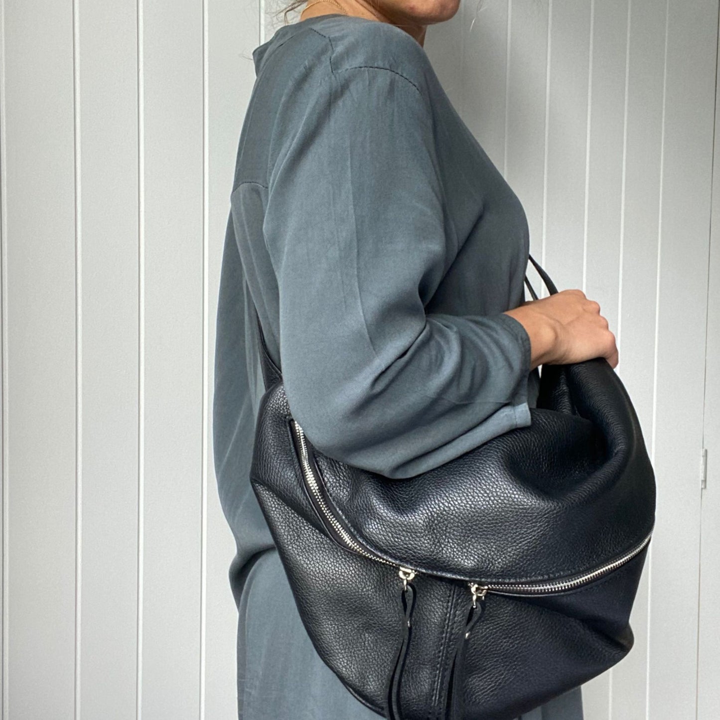 side view of black cross body bag