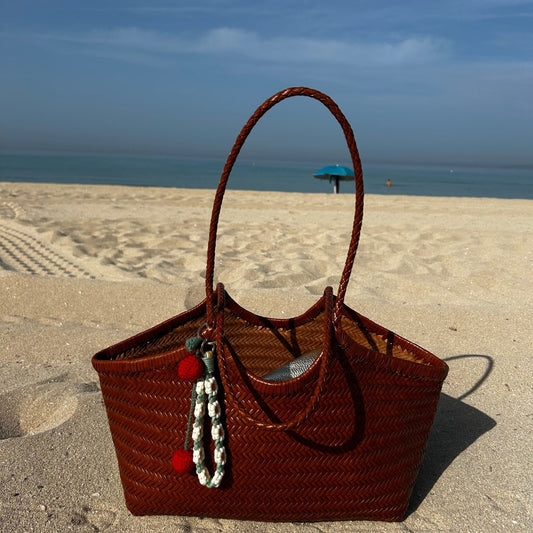 Which size Woven leather basket should I take on holiday?