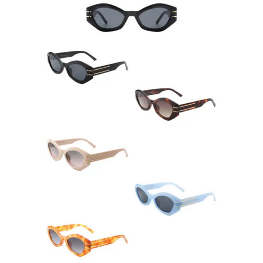 A collection of six pairs of oval and cat-eye style sunglasses in various colours, including black, tortoiseshell, beige, light blue, and orange, featuring bold frames with metallic accents on the sides.