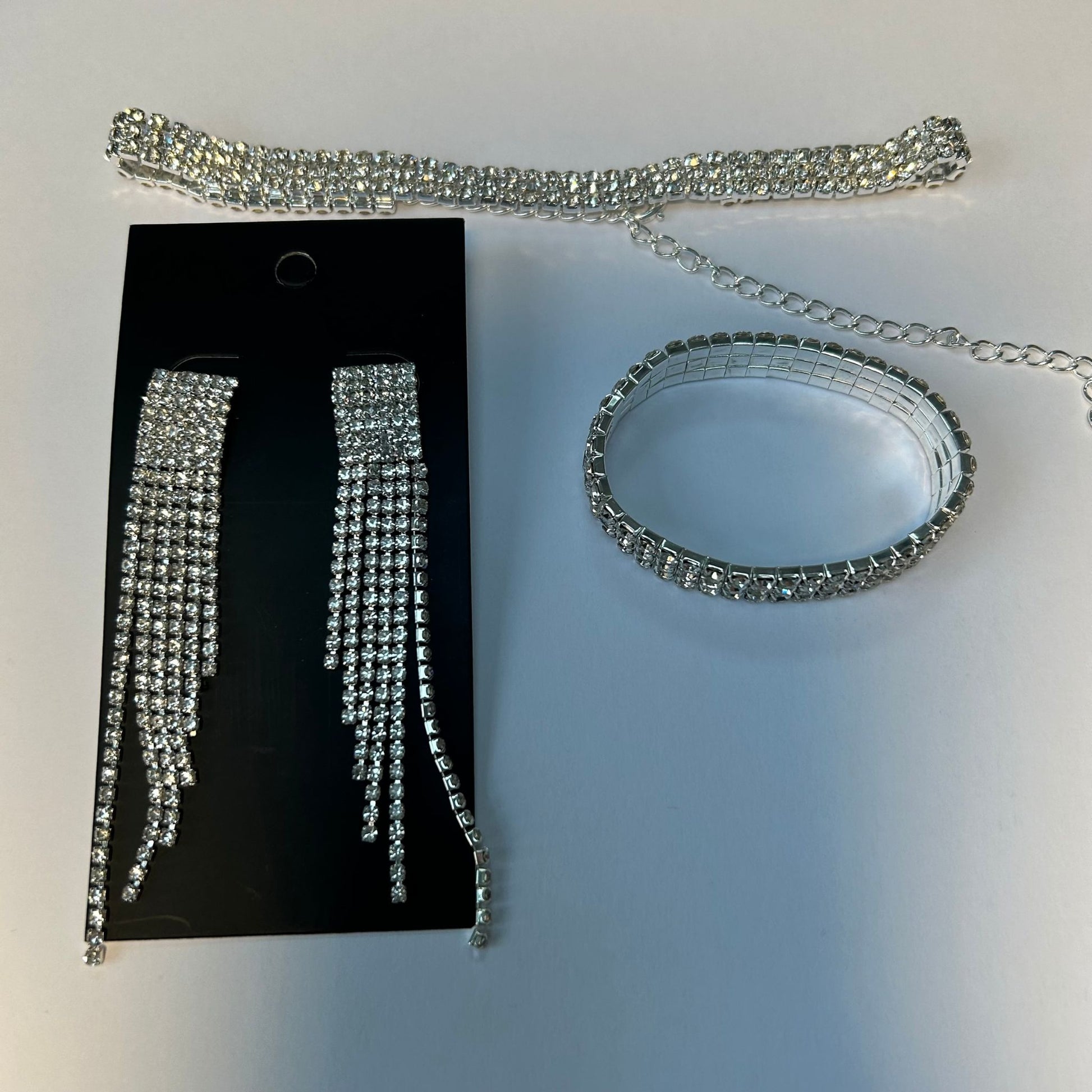 Crystal Earrings, Choker, and Bracelet set in black crystal displayed on a white background.