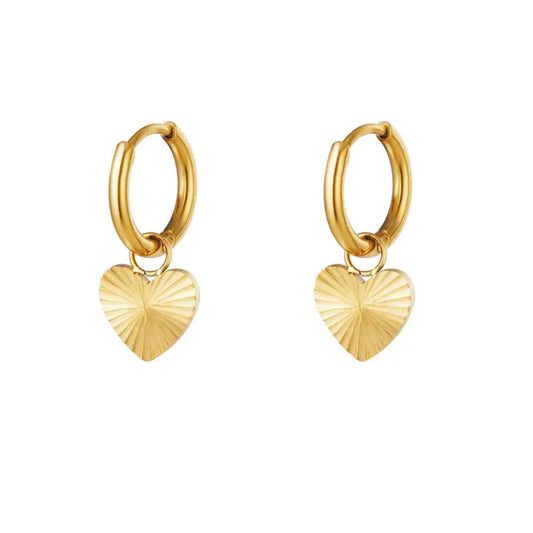 Pair of gold hoop earrings with a small coin pendant