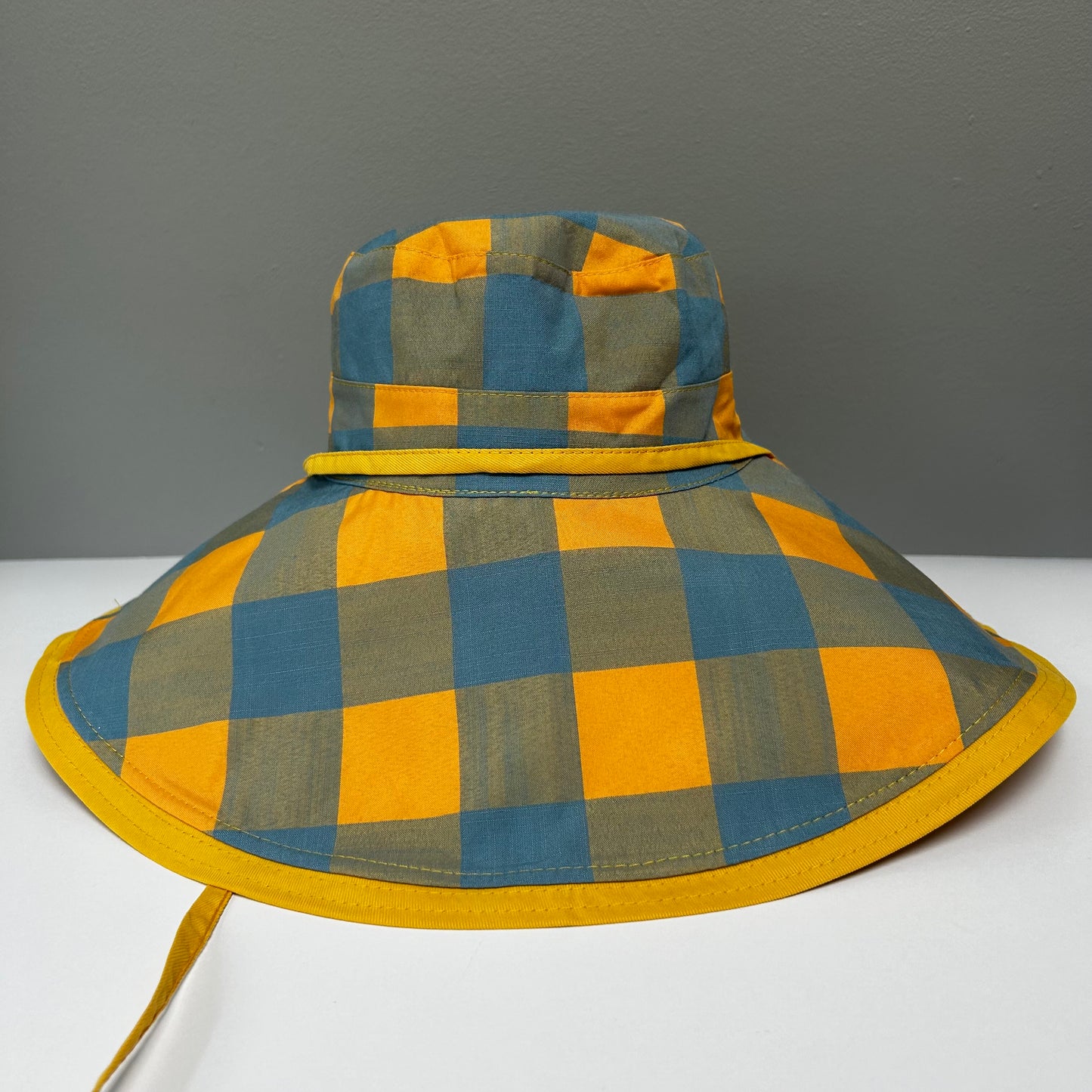 Wide brimmed reversible checked hats