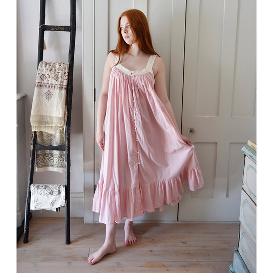 Model wearing the Pink Vintage Style Sundress/Nightdress standing indoors