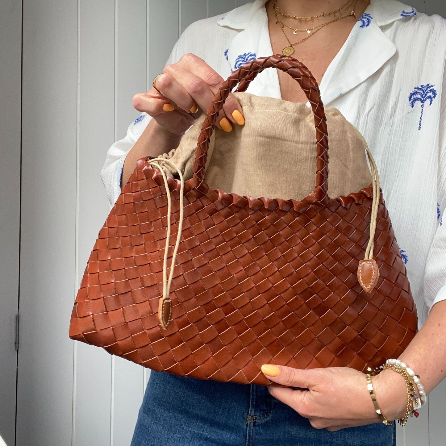 The Woven Leather Hand Held Basket