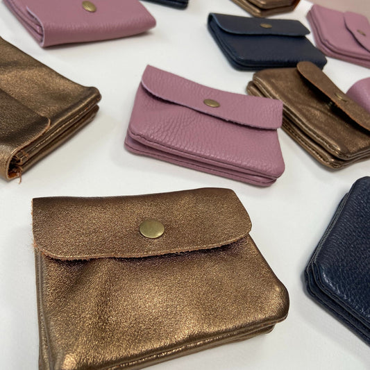 Assorted small leather purses in various colours