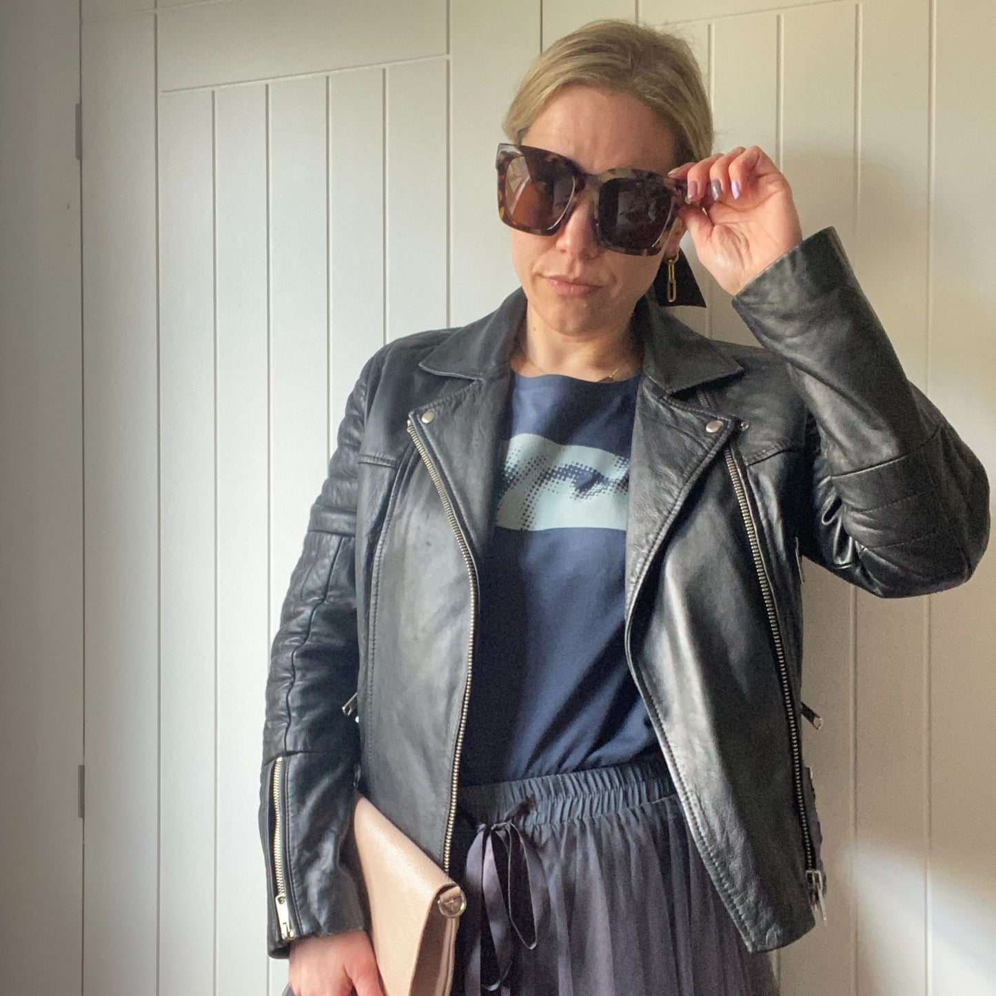 lady in sunglasses with leather jacket