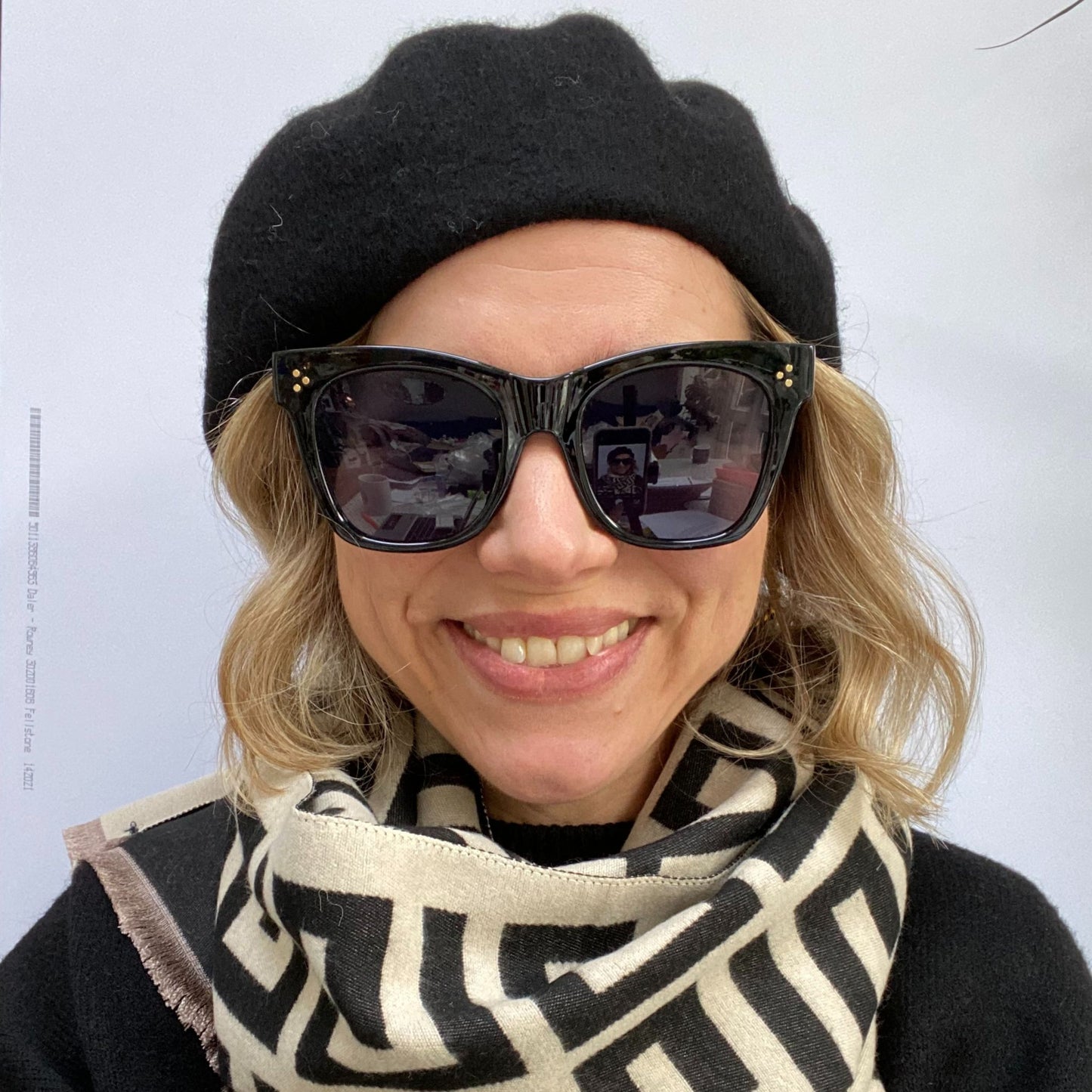 lady wearing cat eye wayfarer sunglasses