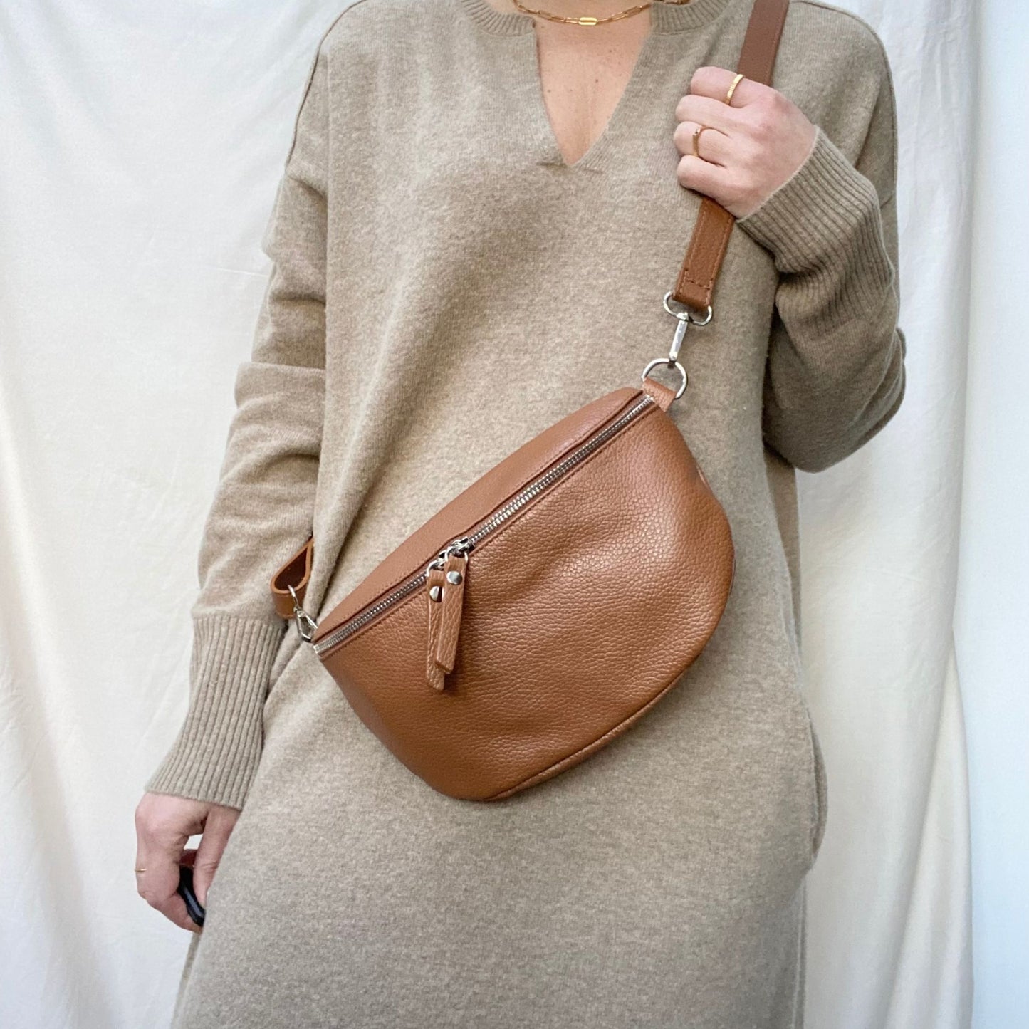 brown leather bumbag on woman
