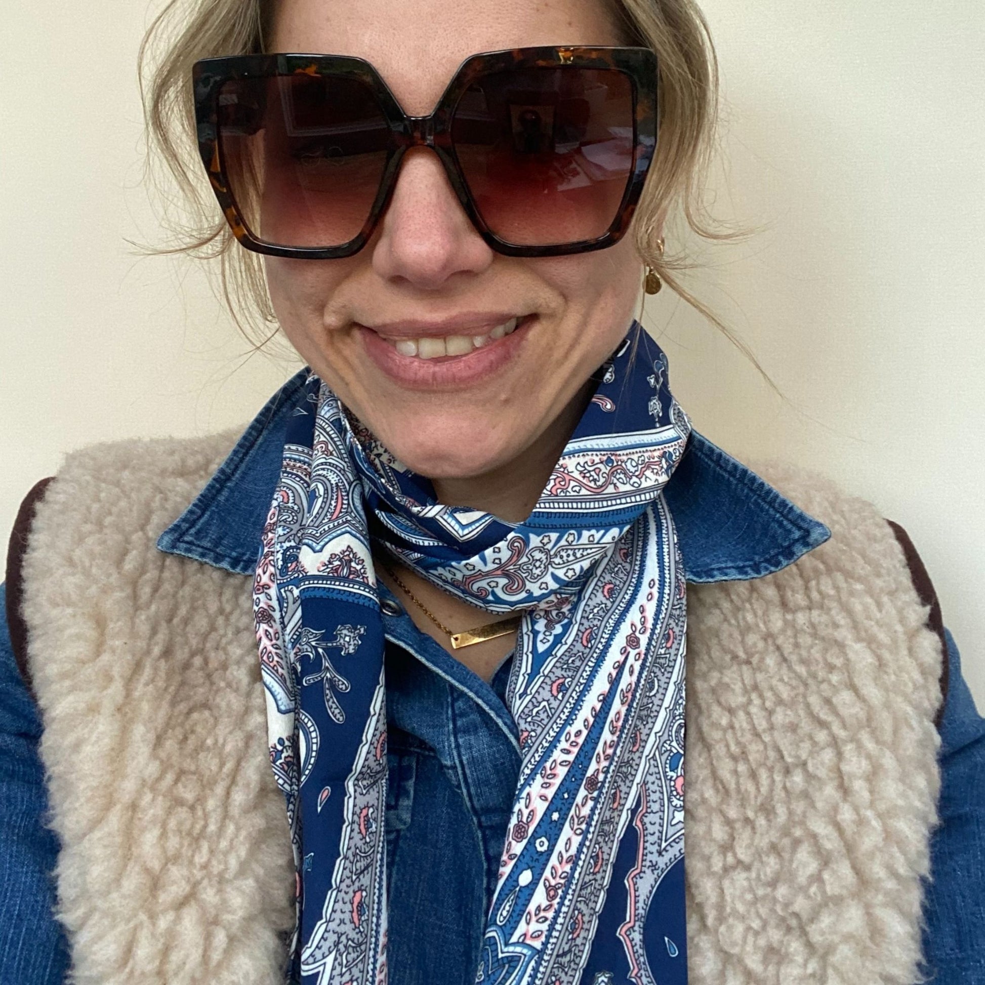 lady wearing paisley neck scarf and sunglasses