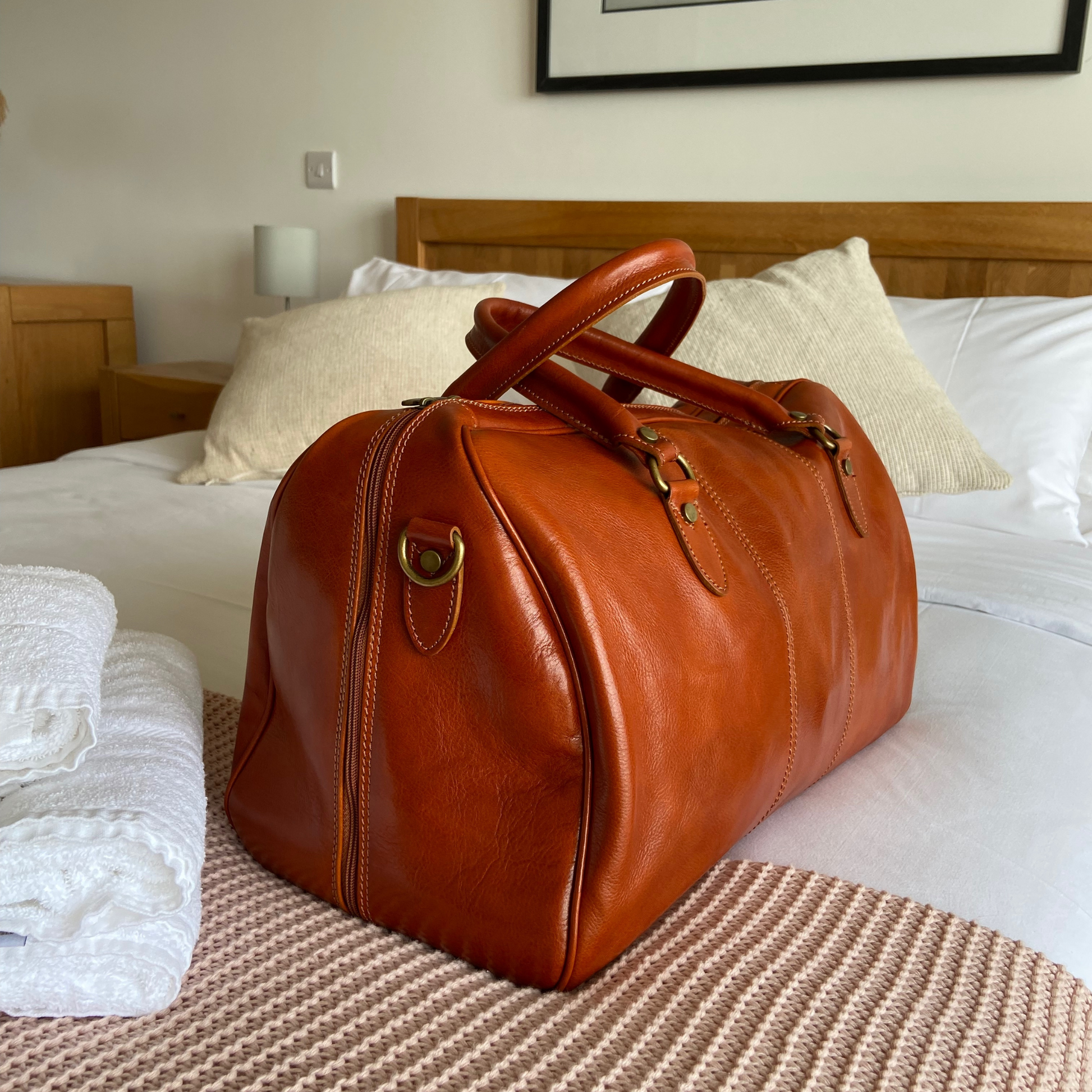 leather holdall on bed